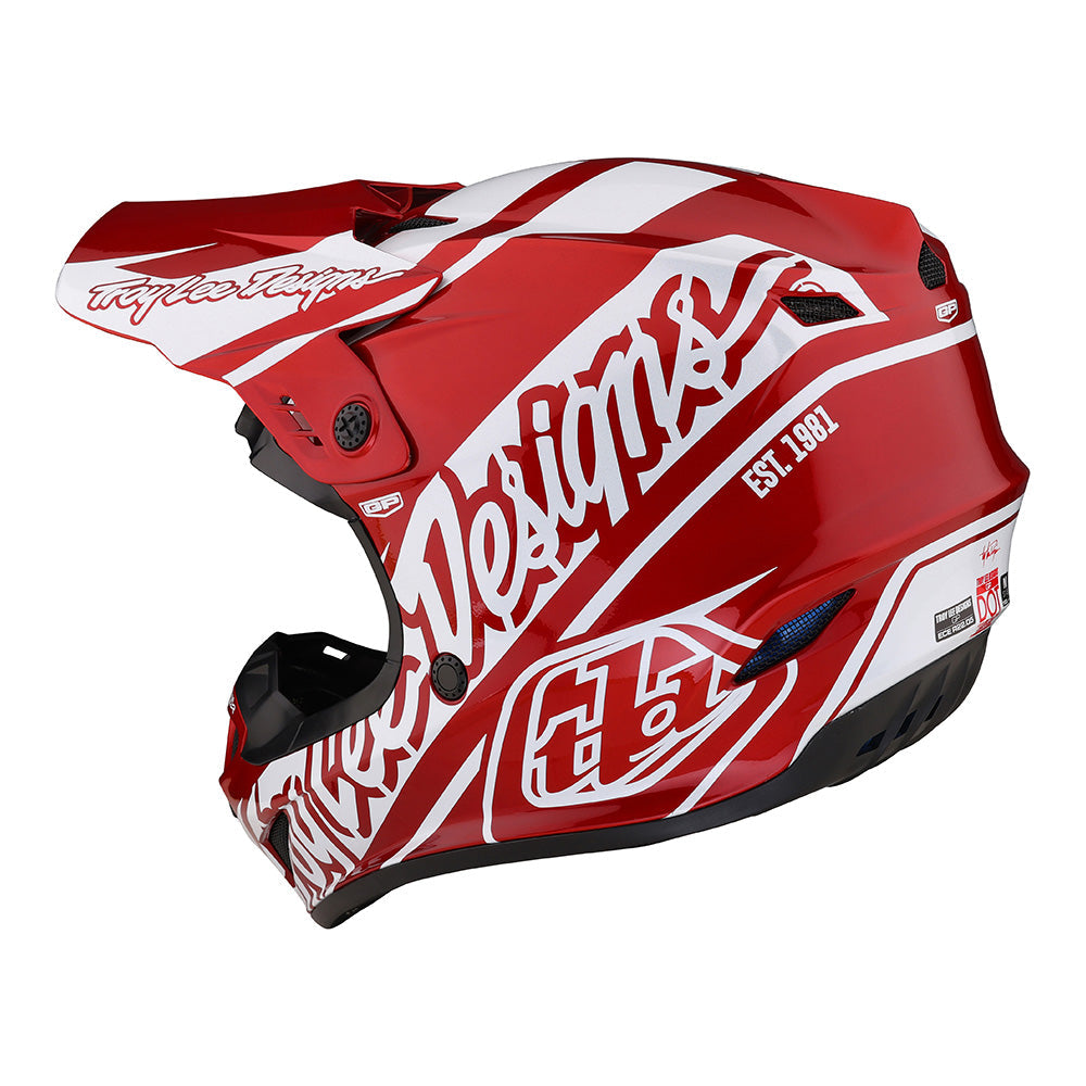 Red and white dirt bike helmet on sale